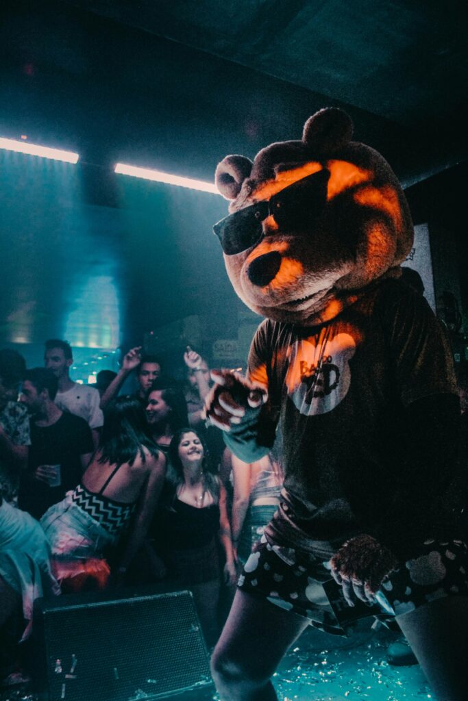 pexels-photo-2311713-2311713 Vibrant nightlife scene at a club in Videira, Brazil featuring a lively mascot performance.